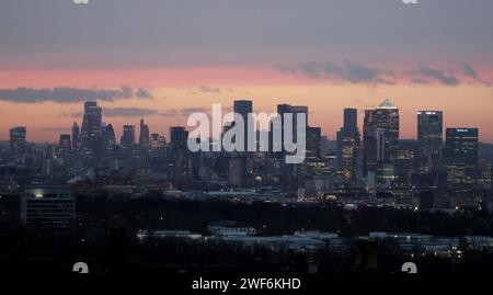 File photo dated 21/01/21 of Canary Wharf and the City of London skyline at sunset as seen from Shooters Hill, London. London has led a rebound in fresh home buyer demand in the first weeks of 2024 - indicating that the tide may be turning for the housing market in the capital, according to a property website. The rebound in London is uniform across the inner city, the suburban outer area and the core commuter areas around the capital, Zoopla said. Issue date: Monday January 29, 2024. Stock Photo