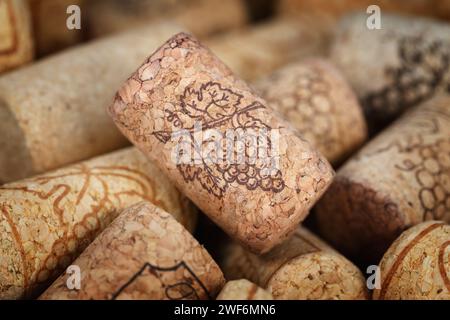 Wine cork with a pattern of a bunch of grapes. Macro photography with shallow depth of field. Stock Photo