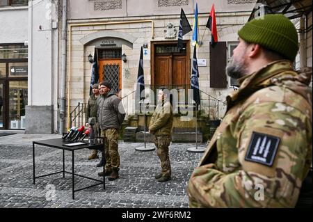 LVIV, UKRAINE - JANUARY 26, 2024 - Head of Ulf Medical Service Alina Mykhailova and Deputy Chief of Intelligence of the Da Vinci Wolves battalion Serhii Filimonov (R to L) are pictured during the opening ceremony of the first recruiting center of the 1st separate battalion 'Da Vinci Wolves' named after Dmytro Kotsiubailo in Lviv, western Ukraine. Stock Photo