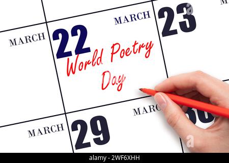 March 22. Hand writing text World Poetry Day on calendar date. Save the date. Holiday. Day of the year concept. Stock Photo