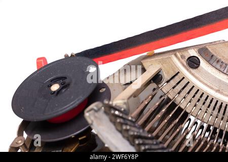 Broken metal typewriter, vintage object isolated, full frame Stock Photo