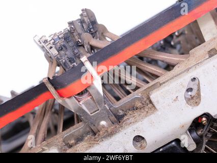 Broken metal typewriter, vintage object isolated, full frame Stock Photo