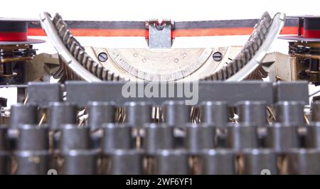 Broken metal typewriter, vintage object isolated, full frame Stock Photo