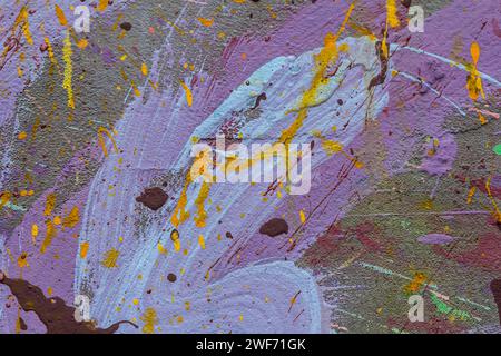White plastered wall splattered with red paint. Paint splashes on the wall. Painted plaster wall. Abstract background. Painted plaster texture. Stock Photo