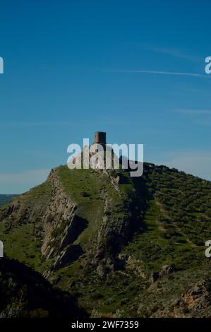 A medieval castle perched on a green hill. Stock Photo