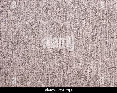 Abstract textured beige wallpaper background or backdrop with wavy texture patterns. Seamless material wallpaper with rough vintage, weathered and gru Stock Photo