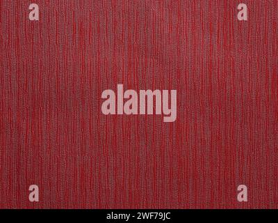 Abstract textured red wallpaper background or backdrop with vertical line texture patterns. Seamless material wallpaper with rough vintage, weathered Stock Photo