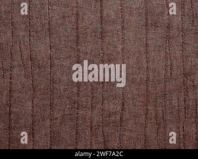Abstract dark brown textured grunge background or backdrop with vertical lines. Wallpaper with rough vintage, weathered and grunge outlook. Copy space Stock Photo