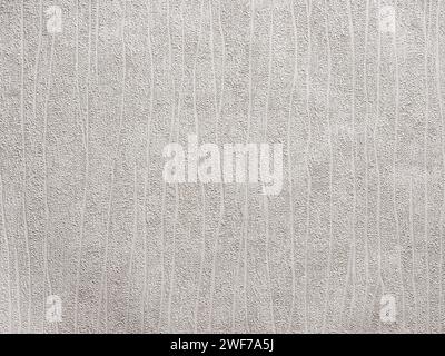 Abstract textured white background or backdrop with vertical curved lines. Wallpaper with copy space for design. Stock Photo