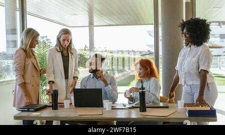 Multiethnic business coworkers working in the office together. Business concept. Stock Photo