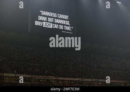 Milan, Italy. 27th Jan, 2024. A quote by by Martin Luther King is displayed on a giant screen at minute 16 during a temporary suspension of the match in support of AC Milan's French goalkeeper #16 Mike Maignan, who was victim of racist abuse during Serie A 2023/24 football match between AC Milan and Bologna FC at San Siro Stadium, Milan, Italy on January 27, 2024 Credit: Independent Photo Agency/Alamy Live News Stock Photo