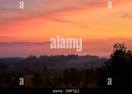 Dramatic sky and misty  morning in the mountain Stock Photo