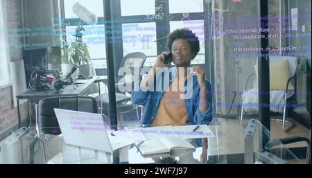 Image of data processing over african american businessman in office Stock Photo