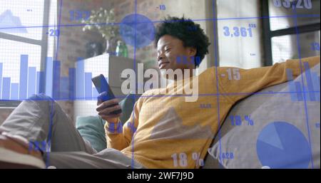 Image of data processing over african american businessman in office Stock Photo