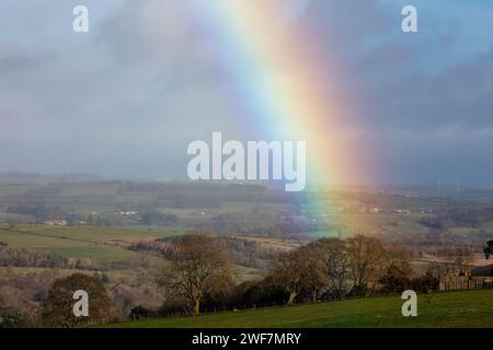 Rainbow over farmland and fields in County Durham, England, UK. Stock Photo