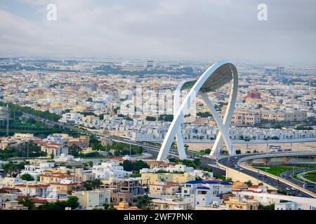 Doha, Qatar - January 24, 2024: Al Wahda Bridge The Tallest Monument of City. known as 56 Bridge of Arch Stock Photo