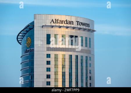 Doha, Qatar - January 10, 2024: Alfardan Towers in Qatar West Bay area. Glassed skyscraper in Doha Downtown, Middle East. Urban scene. Stock Photo