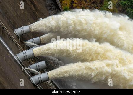 Laggan dam with the power of water flowing through the pipes Stock Photo