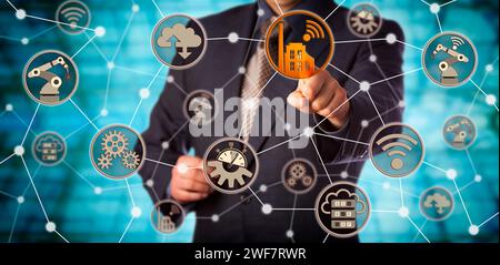 Blue chip manufacturer touching smart factory icon in a virtual machine to machine network. Concept for industry 4.0, computerization of manufacturing Stock Photo