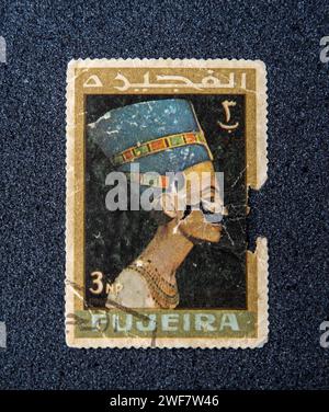 Old postage stamp with Nefertiti. FUJEIRA - CIRCA 1966. Stock Photo