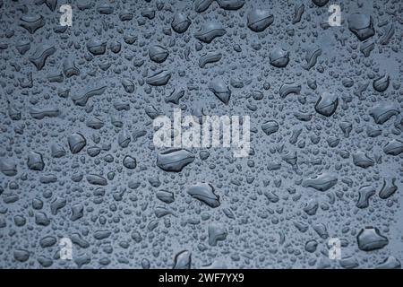raindrops on the metallic surface in rainy days Stock Photo