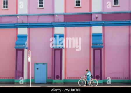 Copenhagen, Denmark. January 29th, 2023. A woman cycles past the Palads Cinema as Copenhagen Fashion Week begins in the city today. Credit: Katie Collins/EMPICS/Alamy Live News Stock Photo