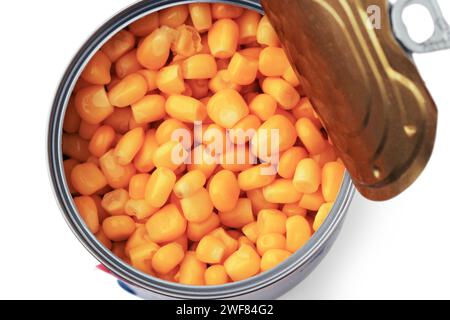 Canned corn kernels in bulk in an open tin can Stock Photo