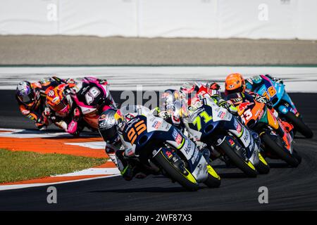 Moment of the Moto3 race at the Valencia Grand Prix, Spain, November 2023, with Dutch rider Collin Veijer leading the group in first position Stock Photo