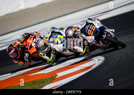 Moment of the Moto3 race at the Valencia Grand Prix, Spain, November 2023, with Dutch rider Collin Veijer leading the group in first position Stock Photo