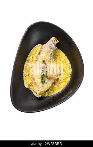 Braised rabbit legs with rosemary and garlic. Isolated on white background. Top view Stock Photo