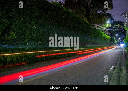 fast bright movement of a car on the road different colors Stock Photo
