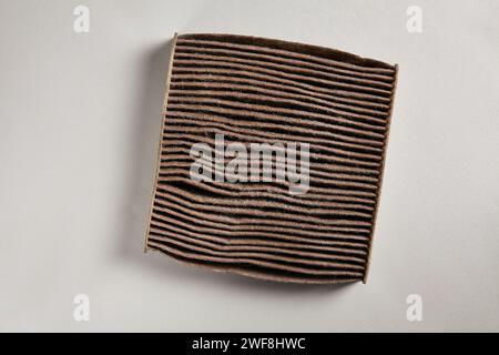 an used car air conditioning filter that is dirty and needs to be replaced Stock Photo