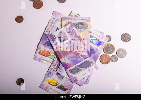 Isolated british pounds notes and coins Stock Photo