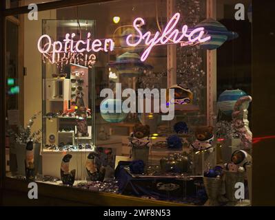 Brussels, Belgium. 26nd Jan, 2024. Opticien Sylva facade shop. Streets of Brussels. Night street photography under artificial lighting. Stock Photo