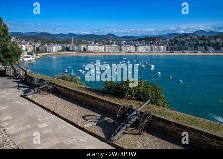 A fortification gun overlooks the town of San Sebastian in the Basque region of Spain Stock Photo