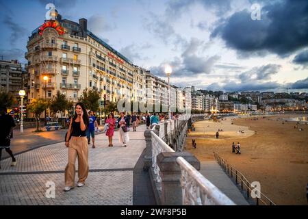 Street lamp at the seaside promenade at dusk, Playa de la Concha, Bahia de la Concha, San Sebastian, Donostia, Camino de la Costa, Camino del Norte, c Stock Photo