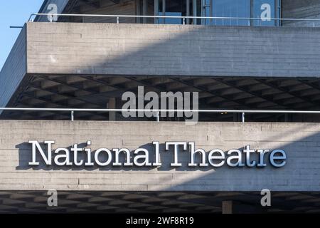 The National Theatre at South Bank London, England, UK. Close-up of the signage on the brutalist building Stock Photo