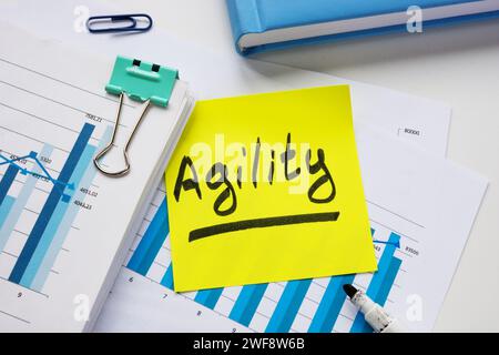 Stack of documents and sticker with inscription agility. Stock Photo