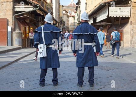 Florence, Italy - April 02 2019: Officers of the Polizia Municipale Firenze on Ponte Vecchio. Stock Photo