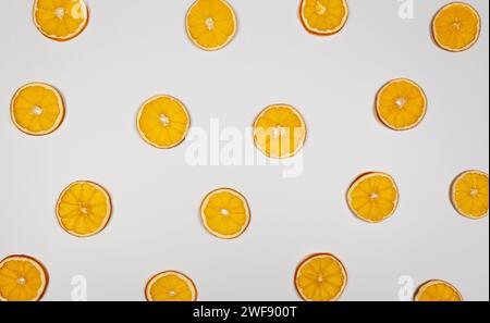 Dried orange slices on white background. Christmas composition, new year, winter concept. Top view, flat lay, copy space. Stock Photo