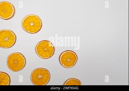 Dried orange slices on white background. Christmas composition, new year, winter concept. Top view, flat lay, copy space. Stock Photo