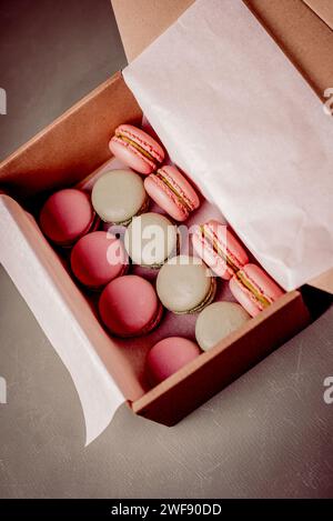 Close up colorful macarons dessert with vintage pastel tones in box. Stock Photo