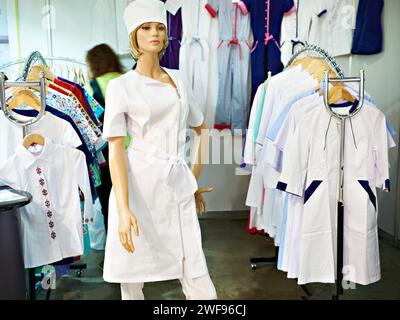 Clothes for dental doctors on mannequin and medical workers in the store Stock Photo