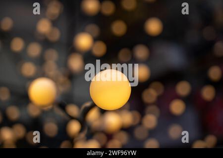 Yellow circular light and blurry lights background Stock Photo