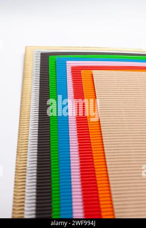 stacked corrugated cardboard papers of various colors Stock Photo