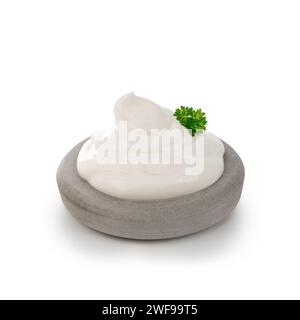 sour cream with herb on stone plate isolated on white background Stock Photo