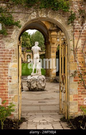UK, England Kent, Hever, Hever Castle, Italian garden statue through arched gate Stock Photo