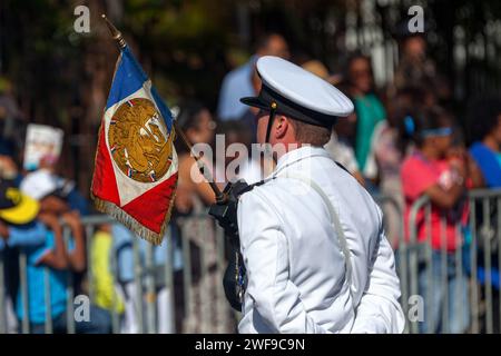 Saint Denis, La Réunion - July 14 2016: Decorated Second master from the French Navy parading with the flag of his regiment during Bastille Day. Stock Photo