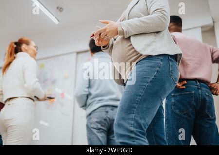 Creative people collaborating and brainstorming ideas in a corporate office Stock Photo