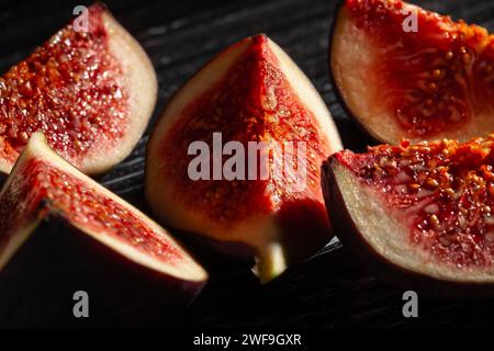 sliced figs on black background Stock Photo
